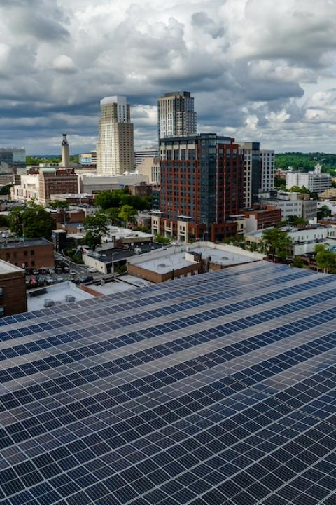 Solar panels on a building in a city — green skills